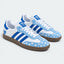 Blue and white heart-pattern low-top sneakers, pair view.