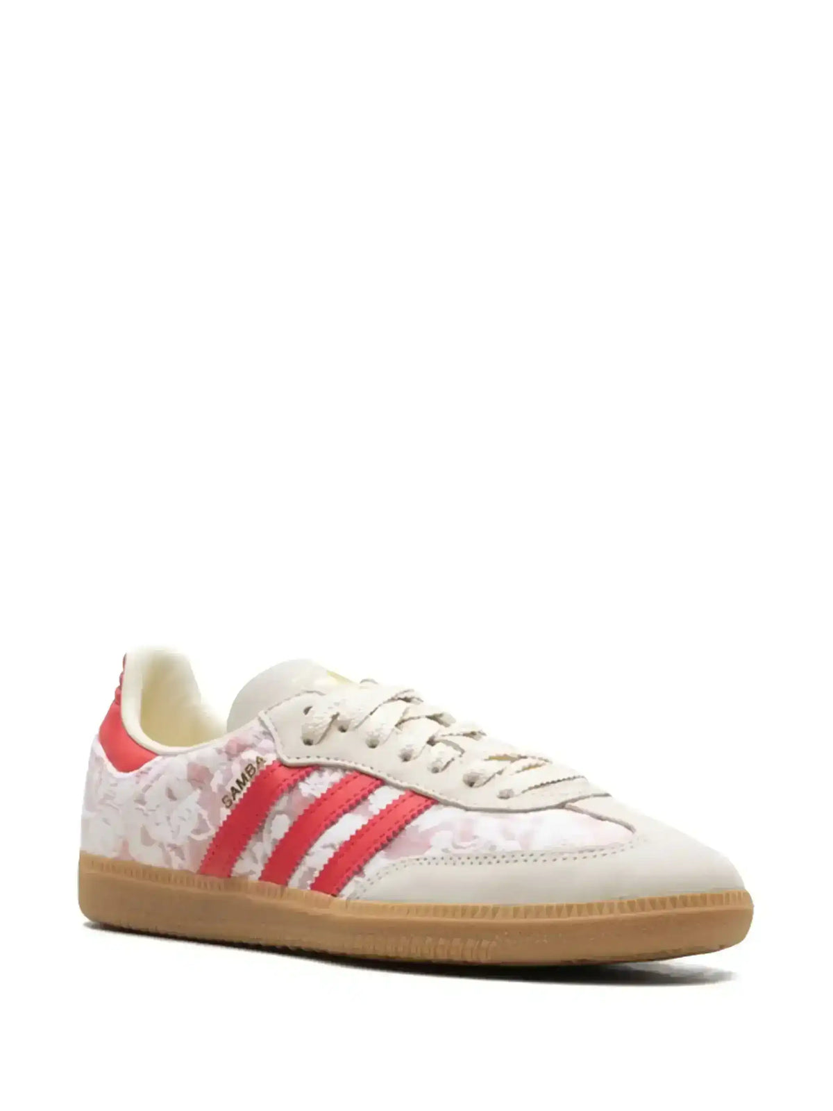 White and red floral-pattern low-top sneakers with gum soles.