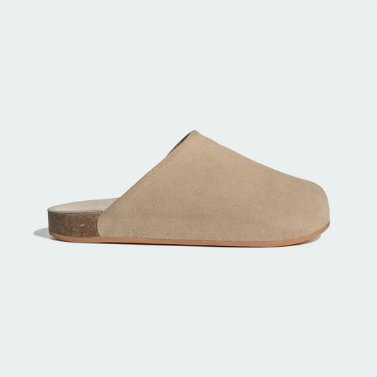 Adidas Adimule Slides in beige velvet featuring a closed-toe mule design and signature three stripes - side profile.