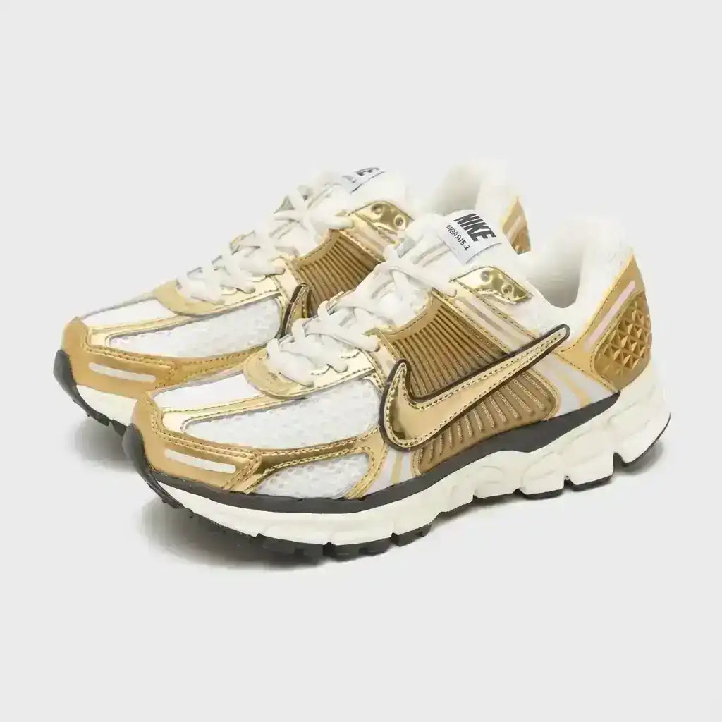 Nike Zoom Vomero 5 Metallic Gold Sneakers. Gold-toned accents.