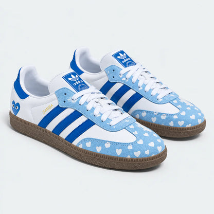 Blue and white heart-pattern low-top sneakers, pair view.
