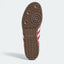 Brown sneaker outsole with circular tread, bottom view.