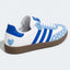 Blue and white heart-pattern low-top sneaker, side view.