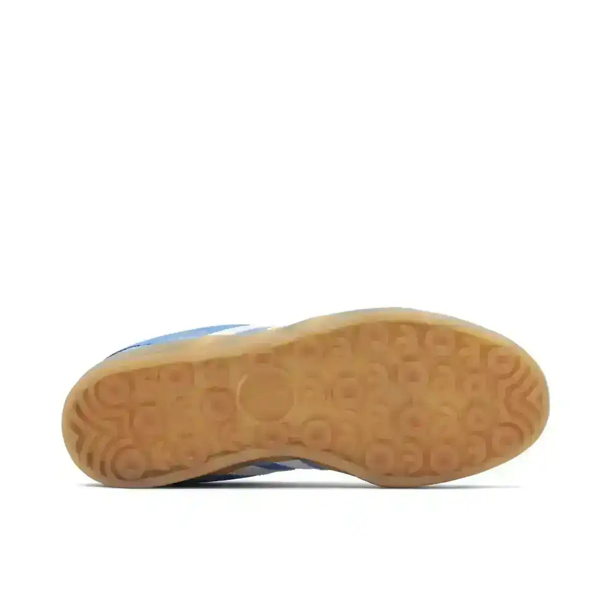 Light brown sneaker outsole with circular tread, bottom view.