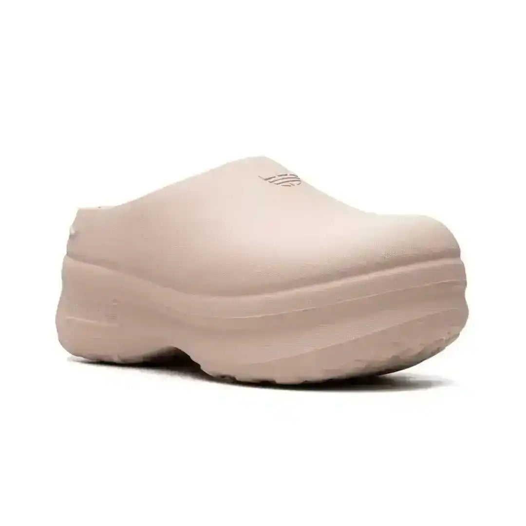 Molded closed-toe clogs with thick rounded soles.