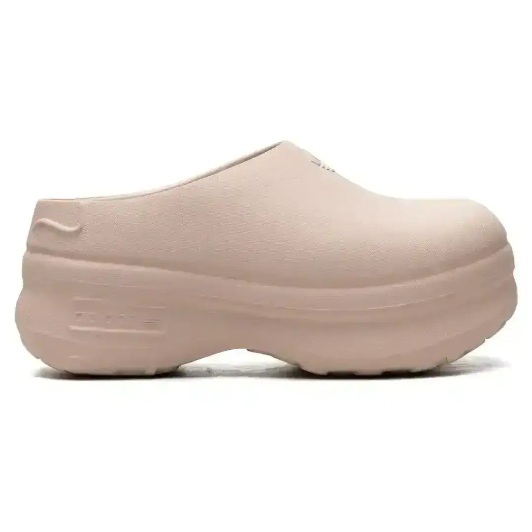 Molded closed-toe clogs with thick rounded soles.
