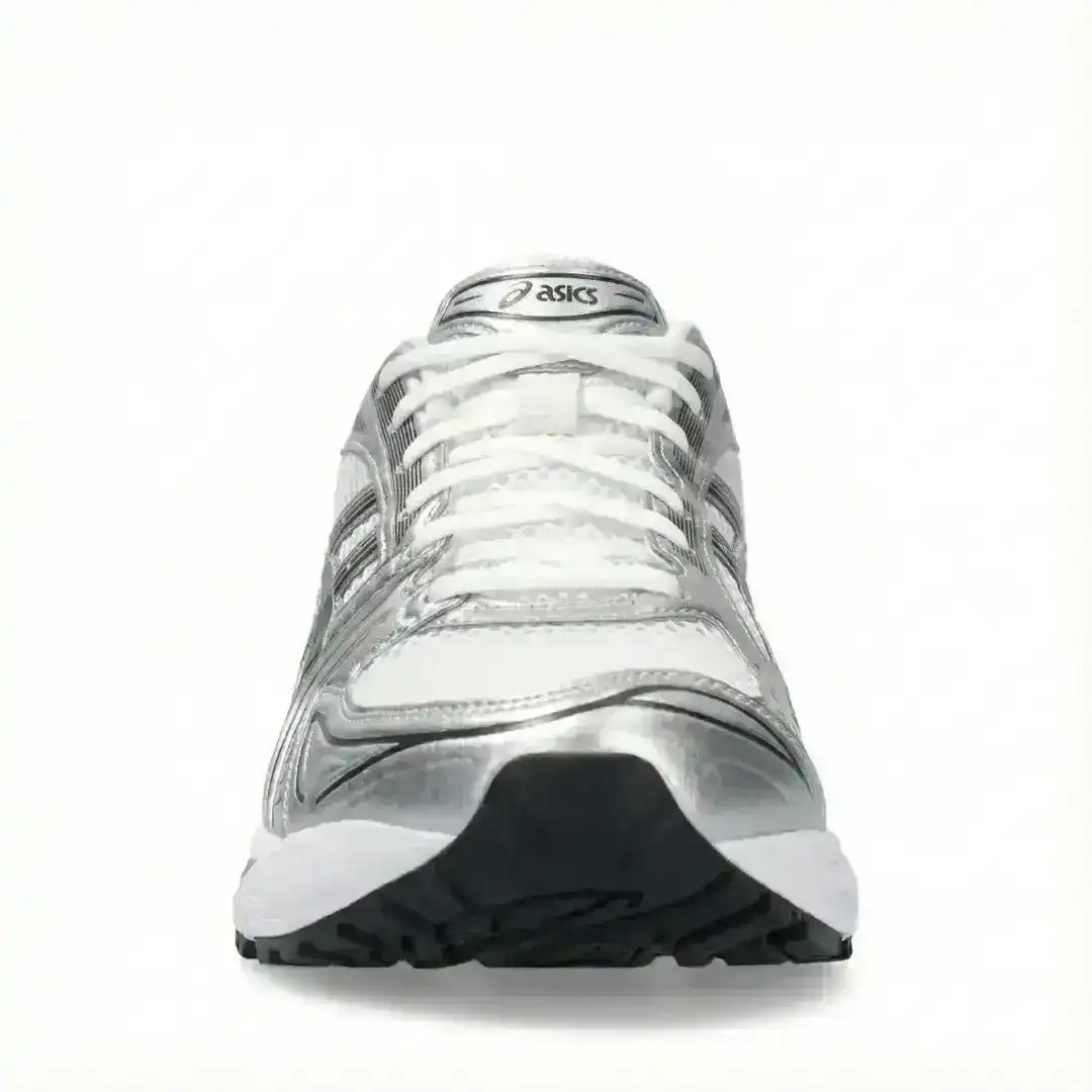 Silver-colored mesh-panel running-style sneakers with dark stripes.