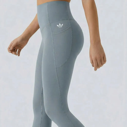 High-waisted leggings with curved seams, product and model views.