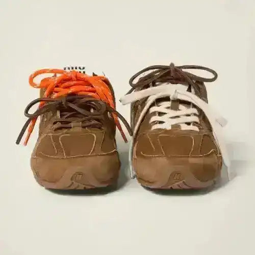 New Balance x Miu Miu 530 SL Sneakers. Brown layered upper.