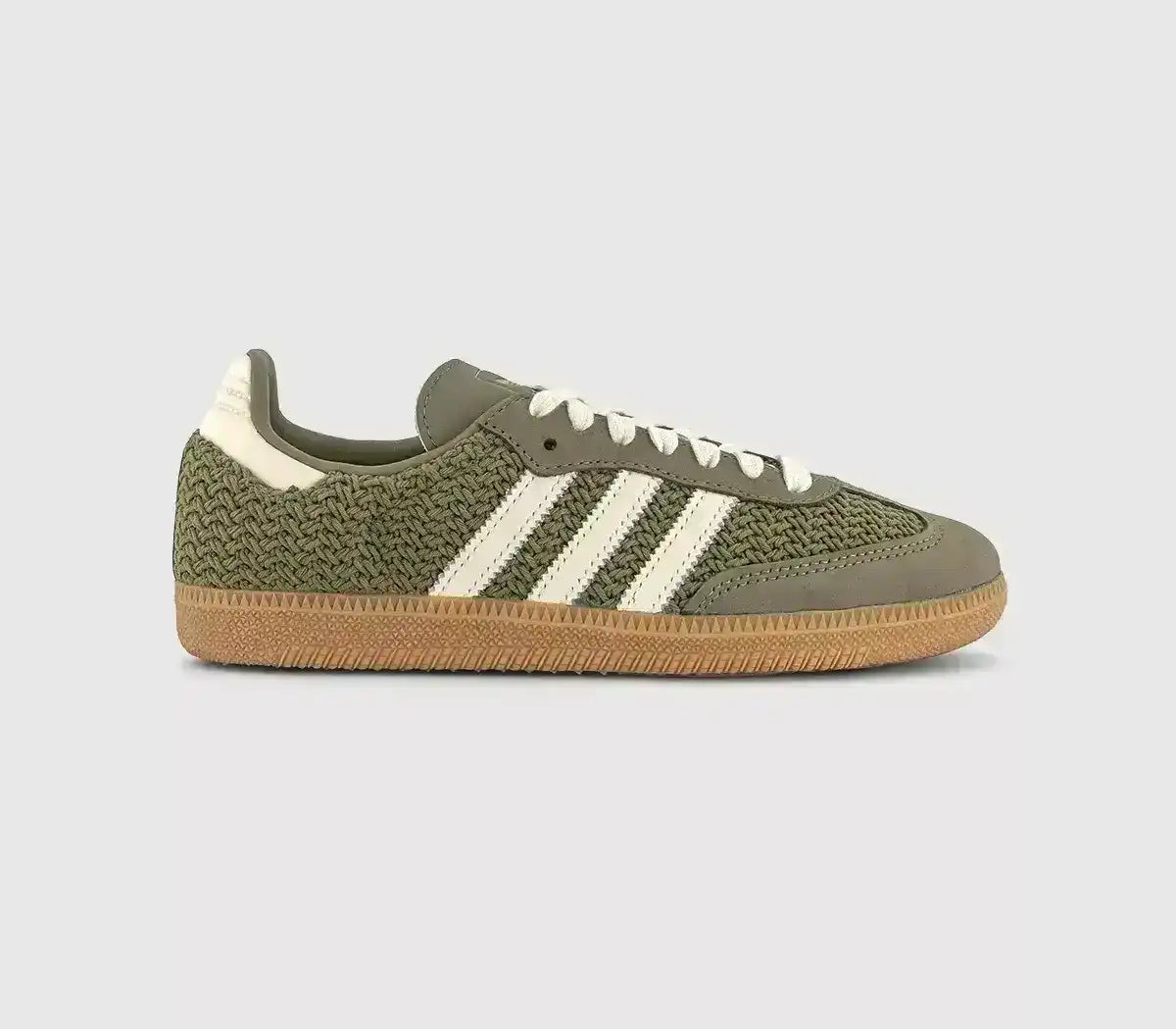 Olive green woven-texture sneakers with cream stripes and gum soles.