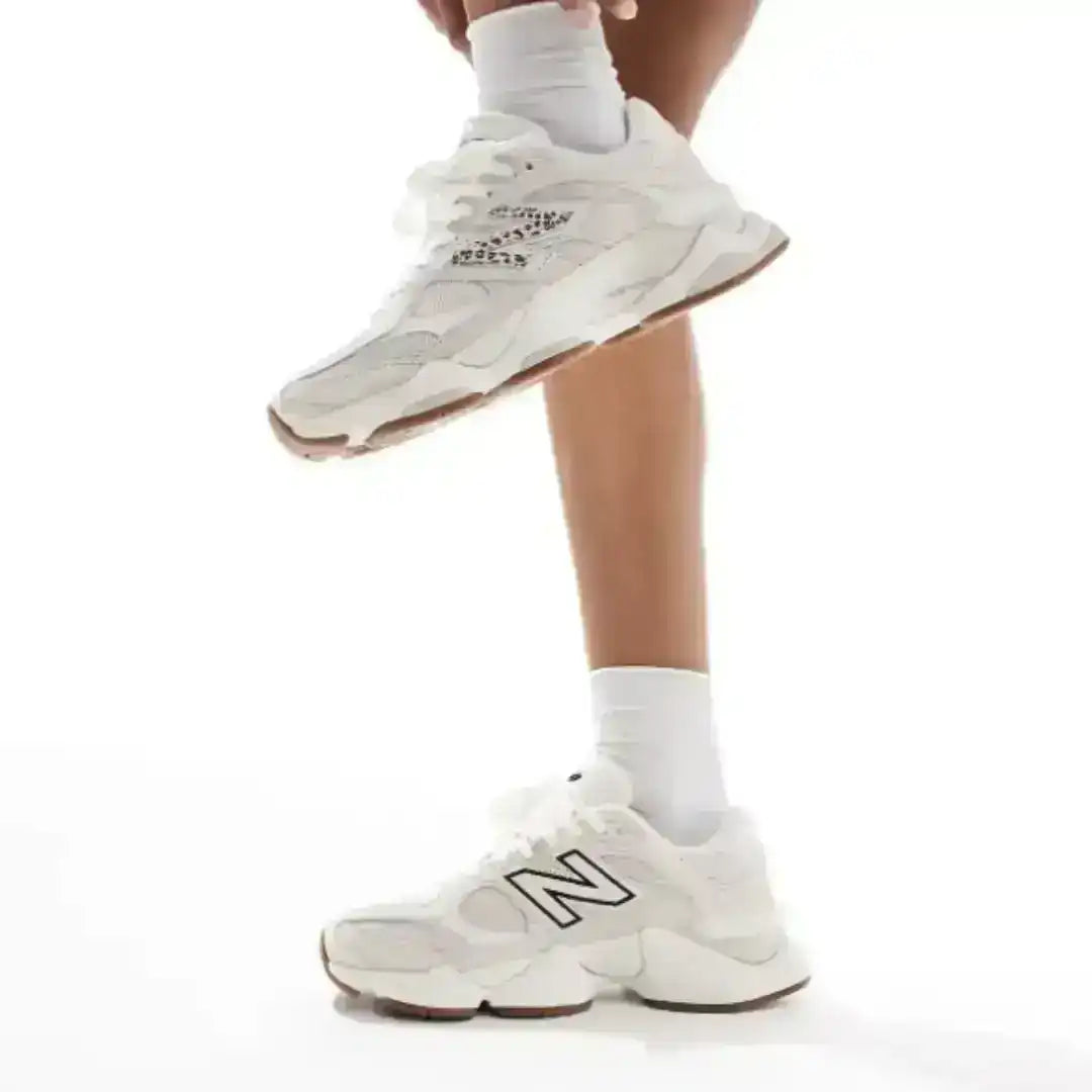 Beige 9060 sneakers worn with white socks, showing both sides of the pair