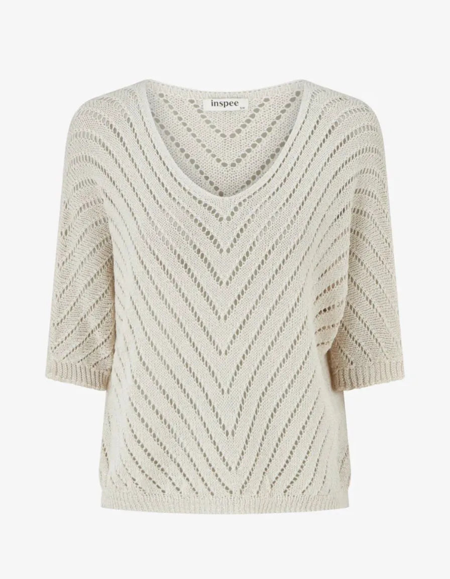 Beige V-Neck Knit Top. Beige knit appearance.