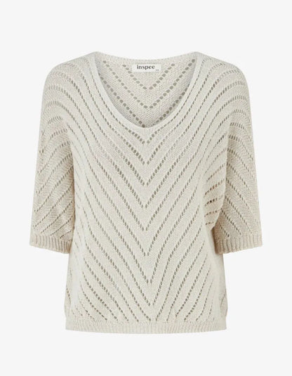 Beige V-Neck Knit Top. Beige knit appearance.