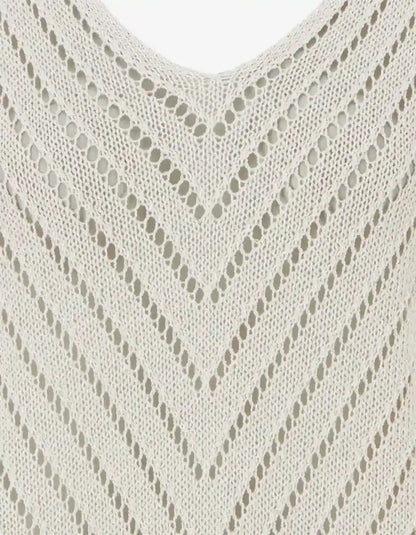 Beige V-neck knit top with a chevron openwork pattern.
