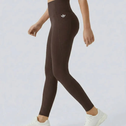 High-waisted leggings with curved seams, product and model views.