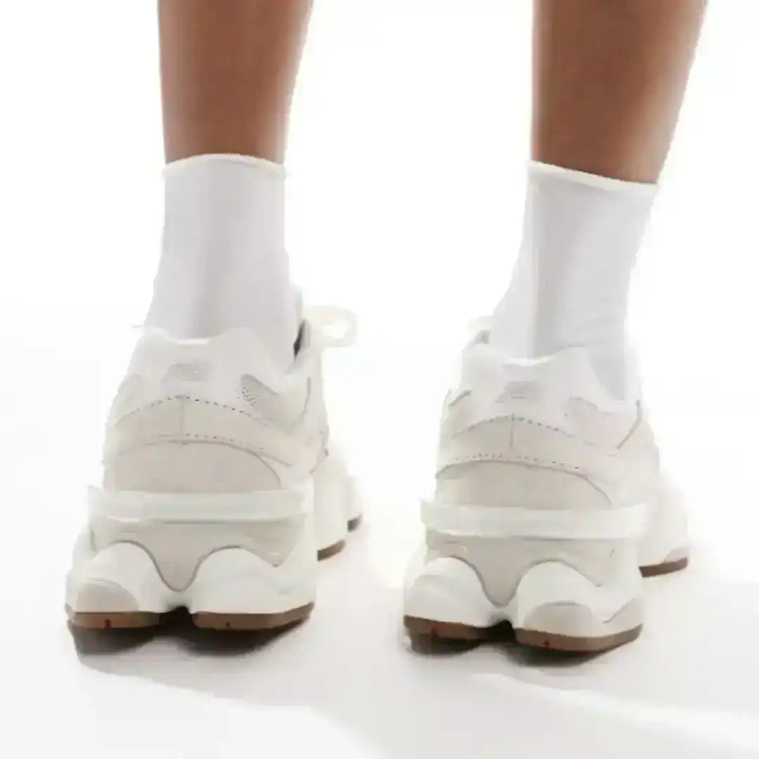 Rear view of beige 9060 sneakers showing the heel panels and sculpted soles