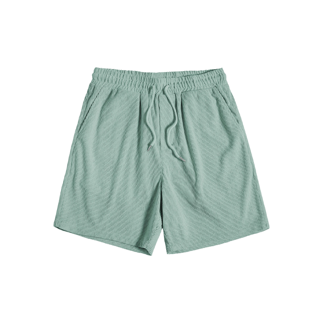 Green drawstring shorts, front product view.