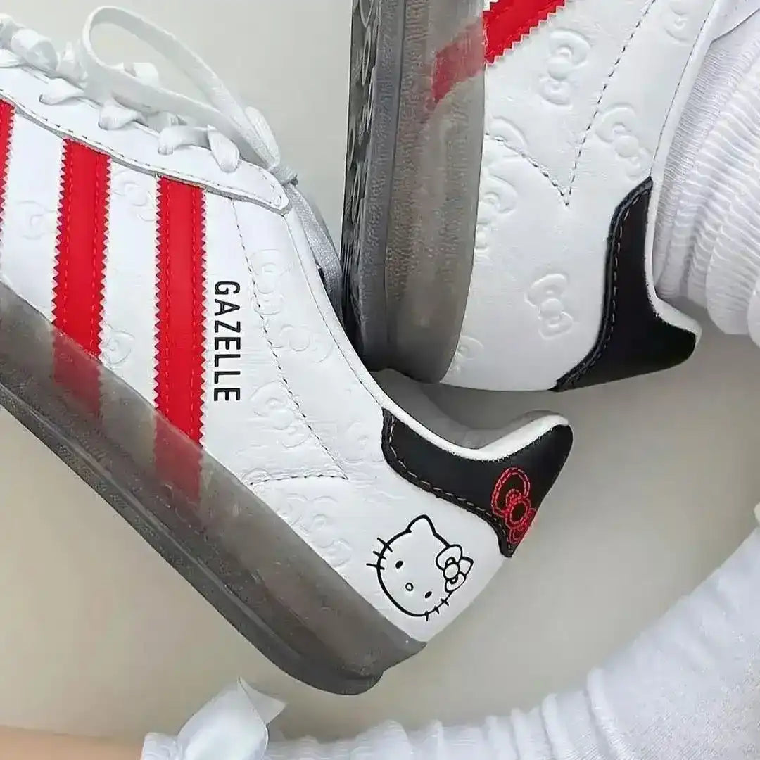Adidas Gazelle Indoor x Hello Kitty shoes with translucent sole and red stripes, a must-have for fans of Sanrio and classic streetwear.