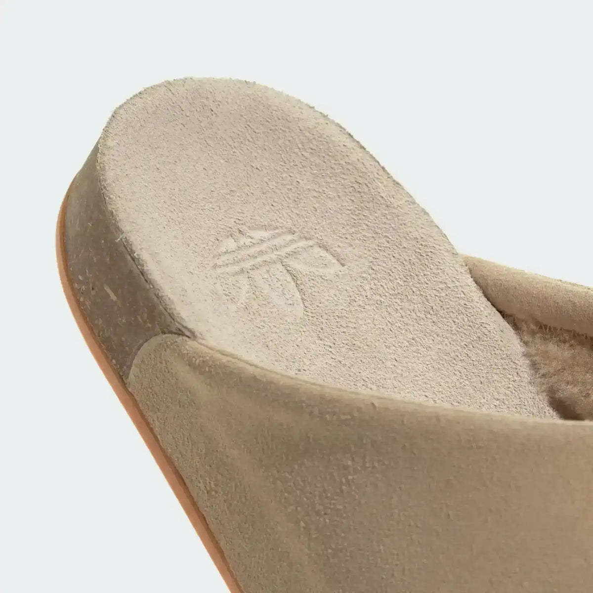 Closed-toe backless slide shoes with contrasting footbeds.