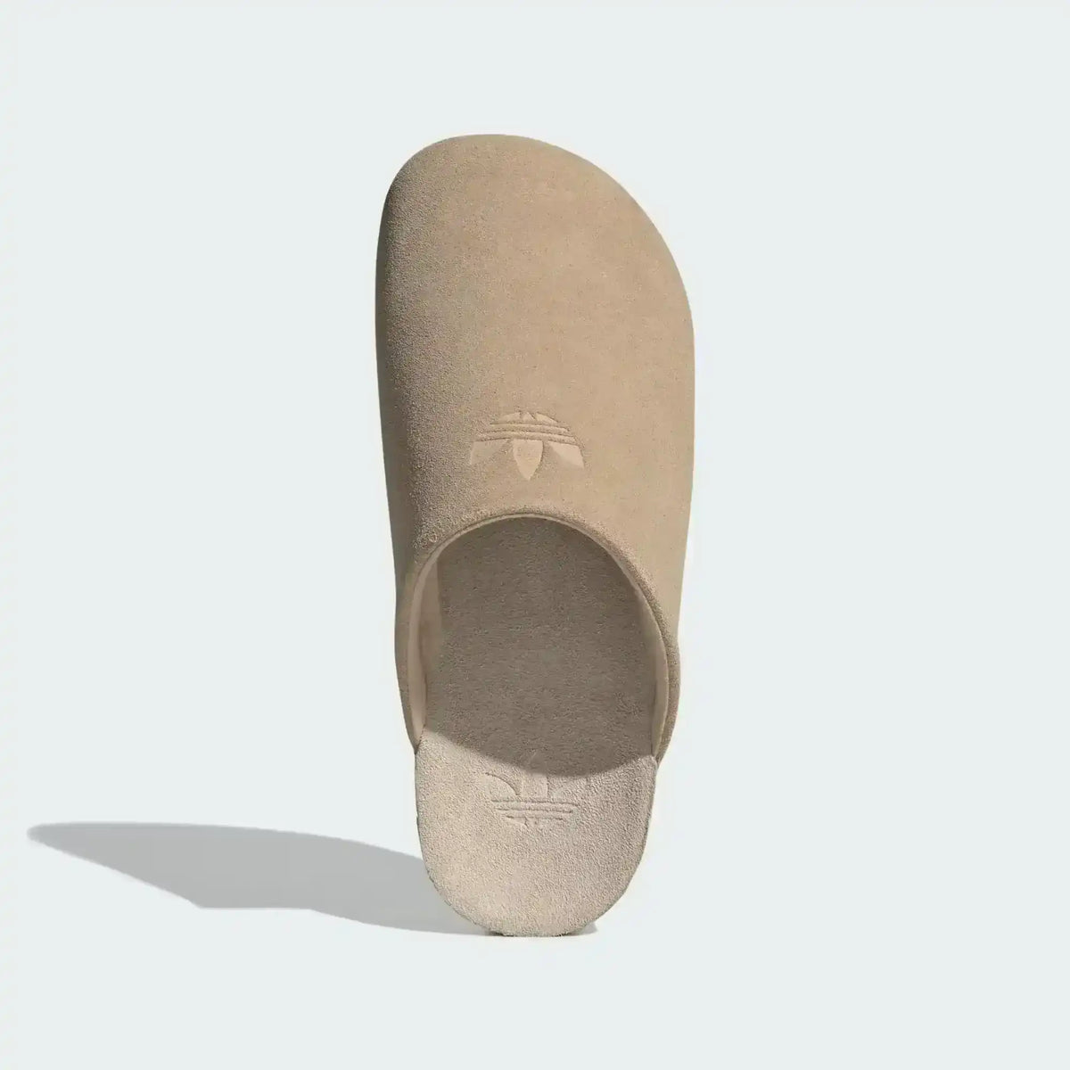 Closed-toe backless slide shoes with contrasting footbeds.