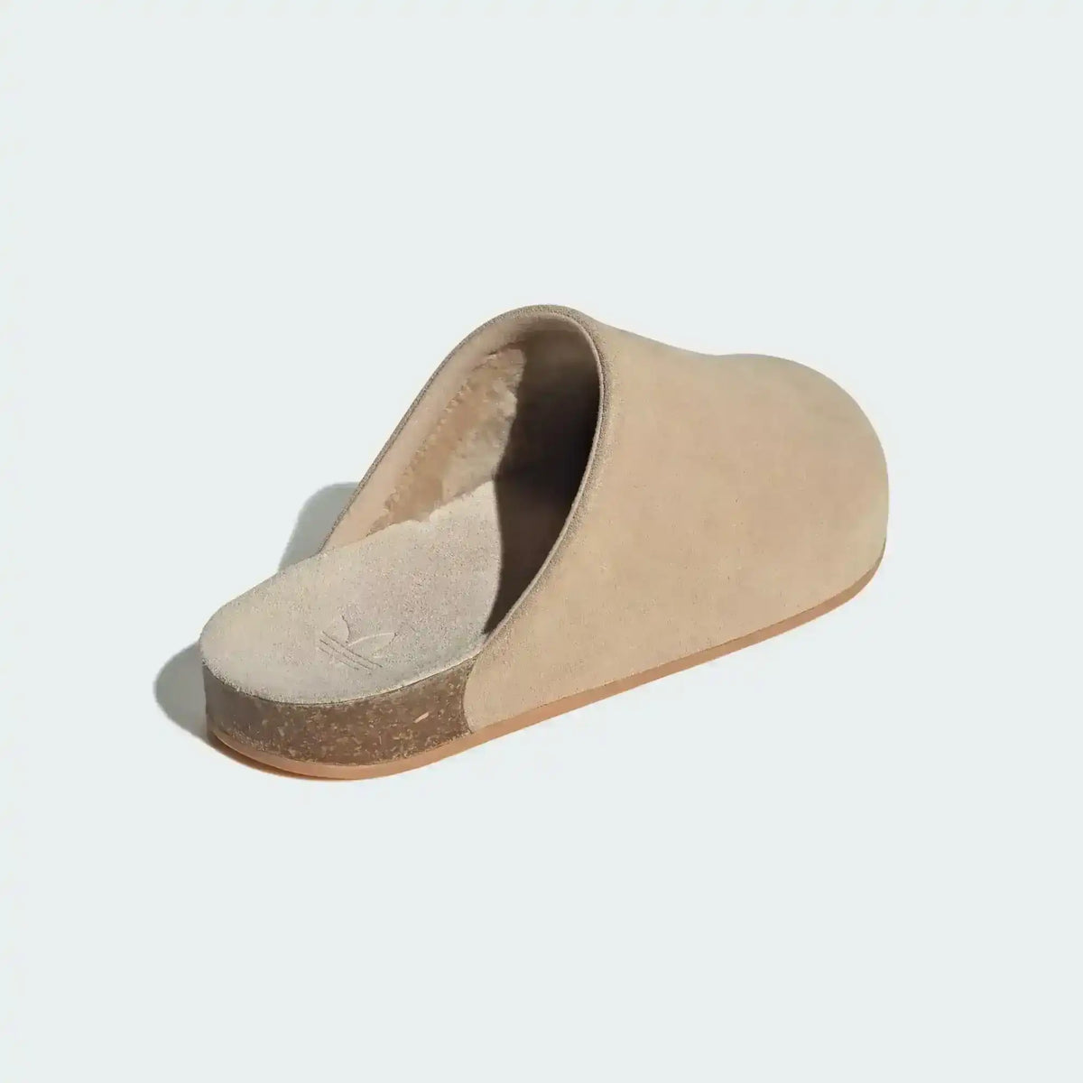 Closed-toe backless slide shoes with contrasting footbeds.