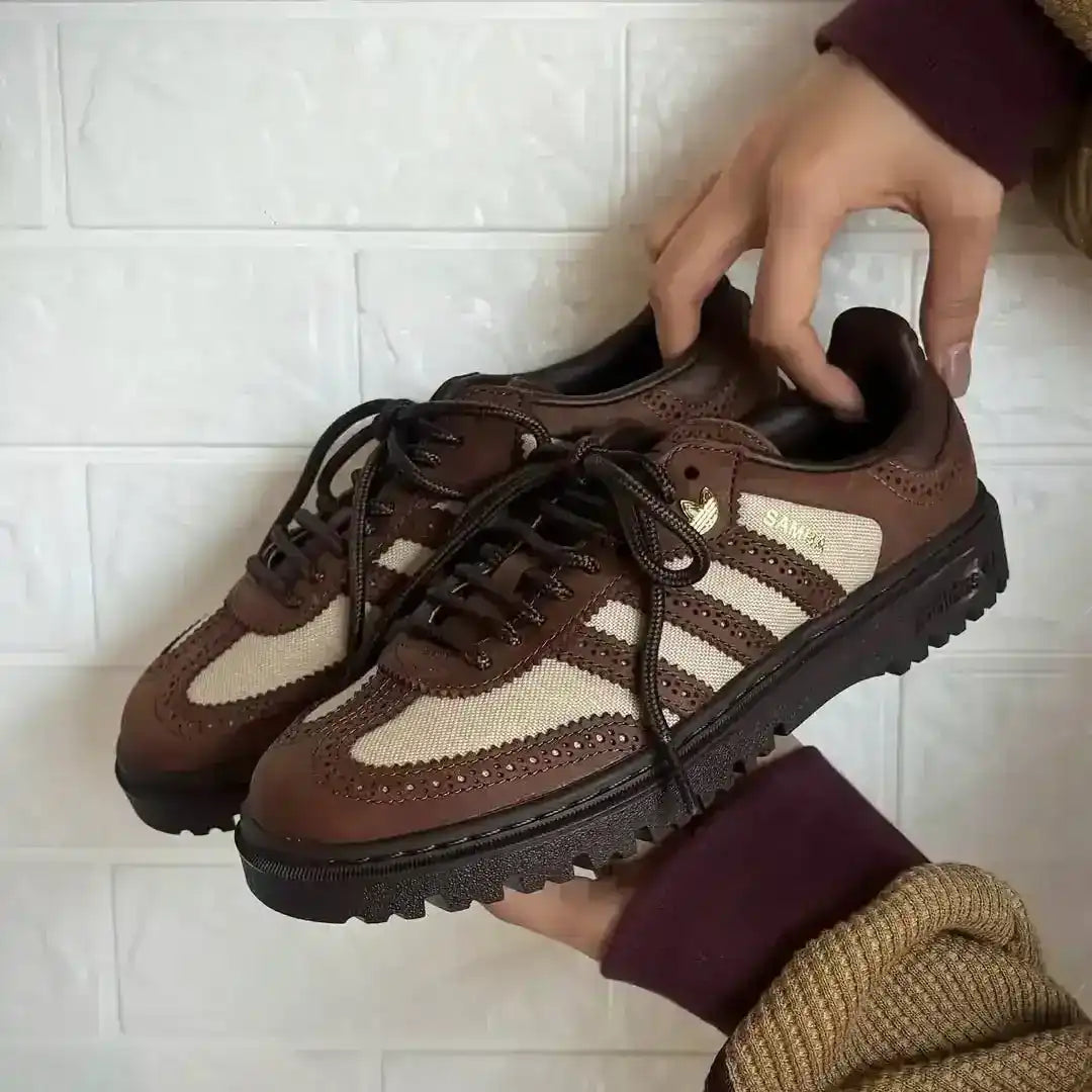 Side profile of Adidas Samba WTR in premium brown leather with gold accents and rugged outsole