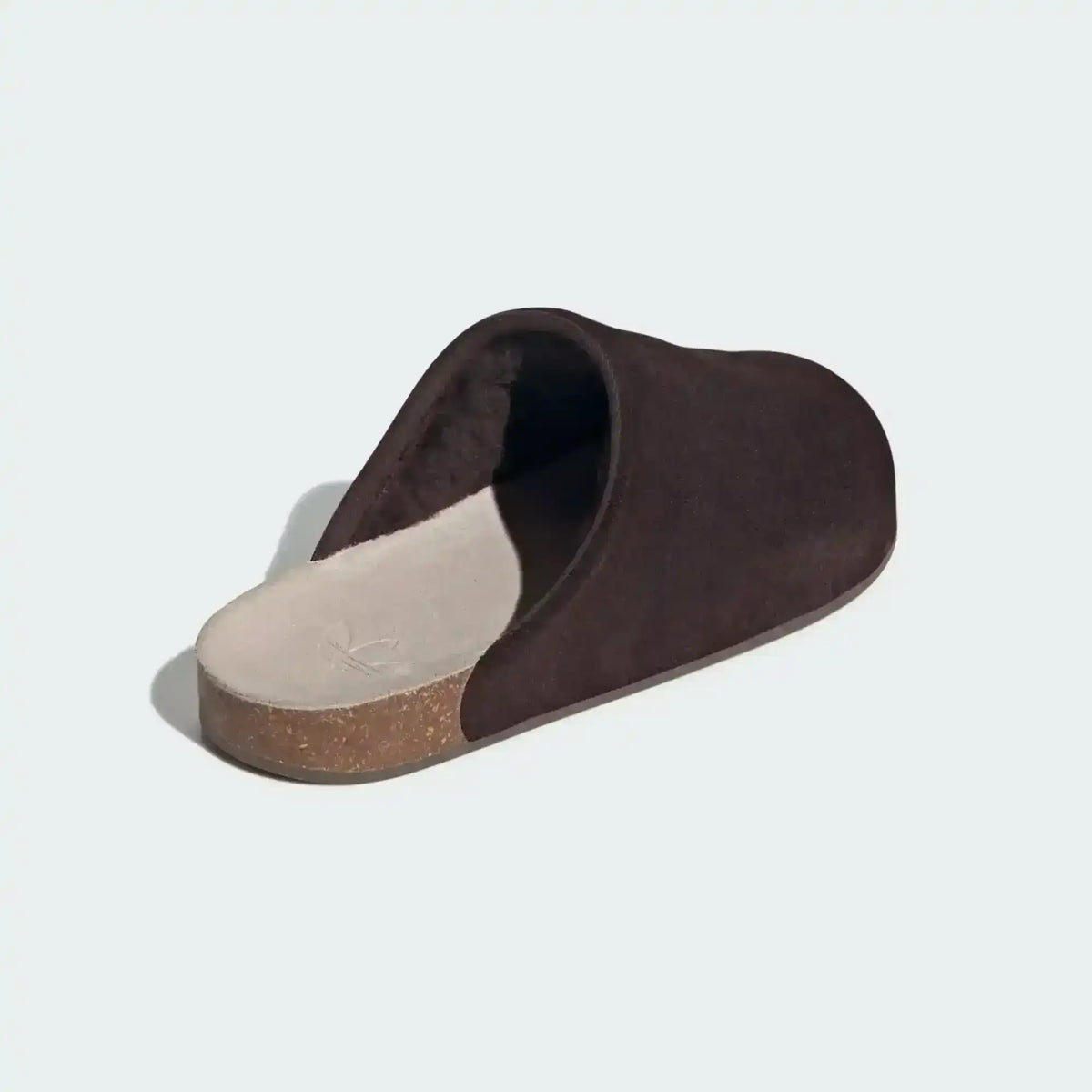Closed-toe backless slide shoes with contrasting footbeds.