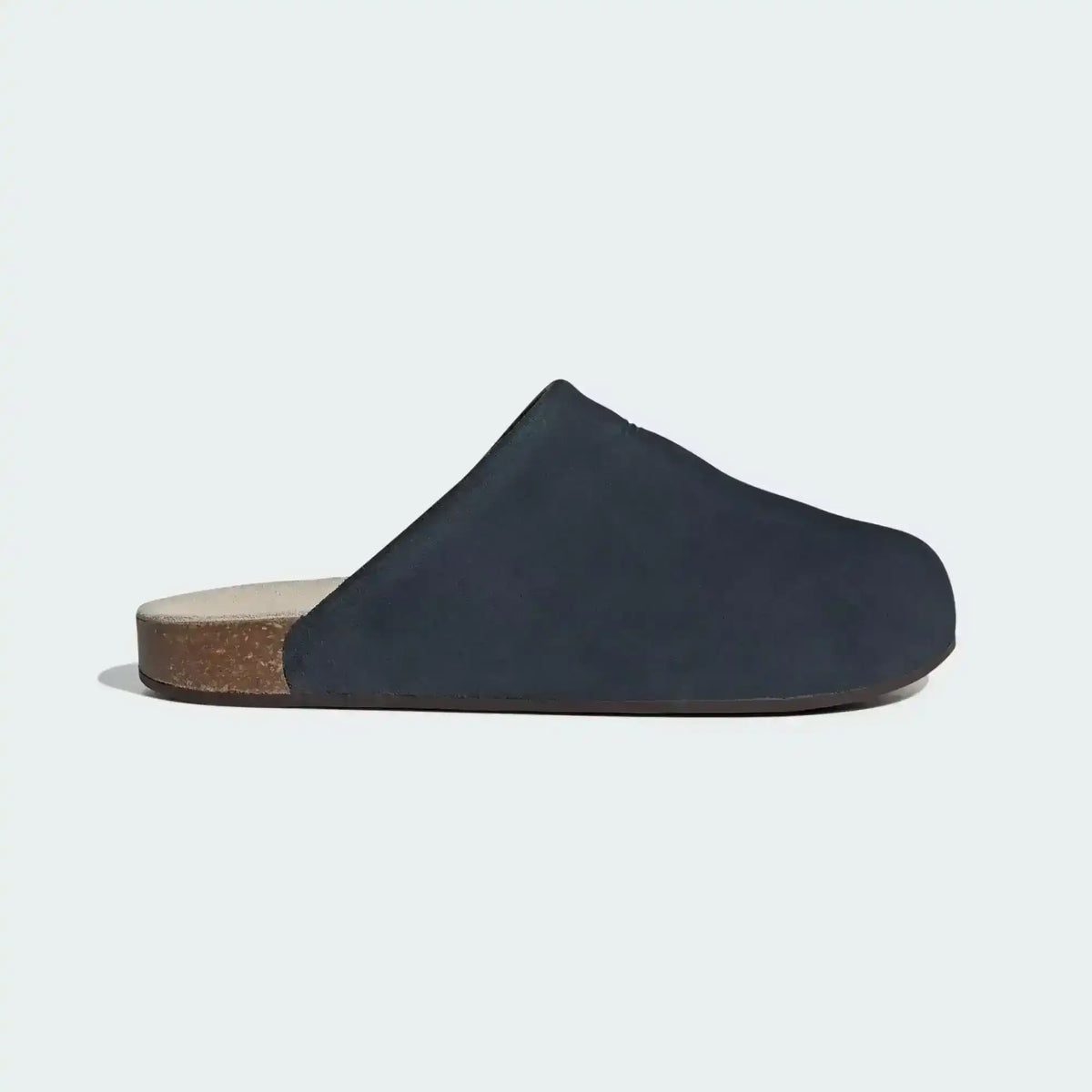 Closed-toe backless slide shoes with contrasting footbeds.