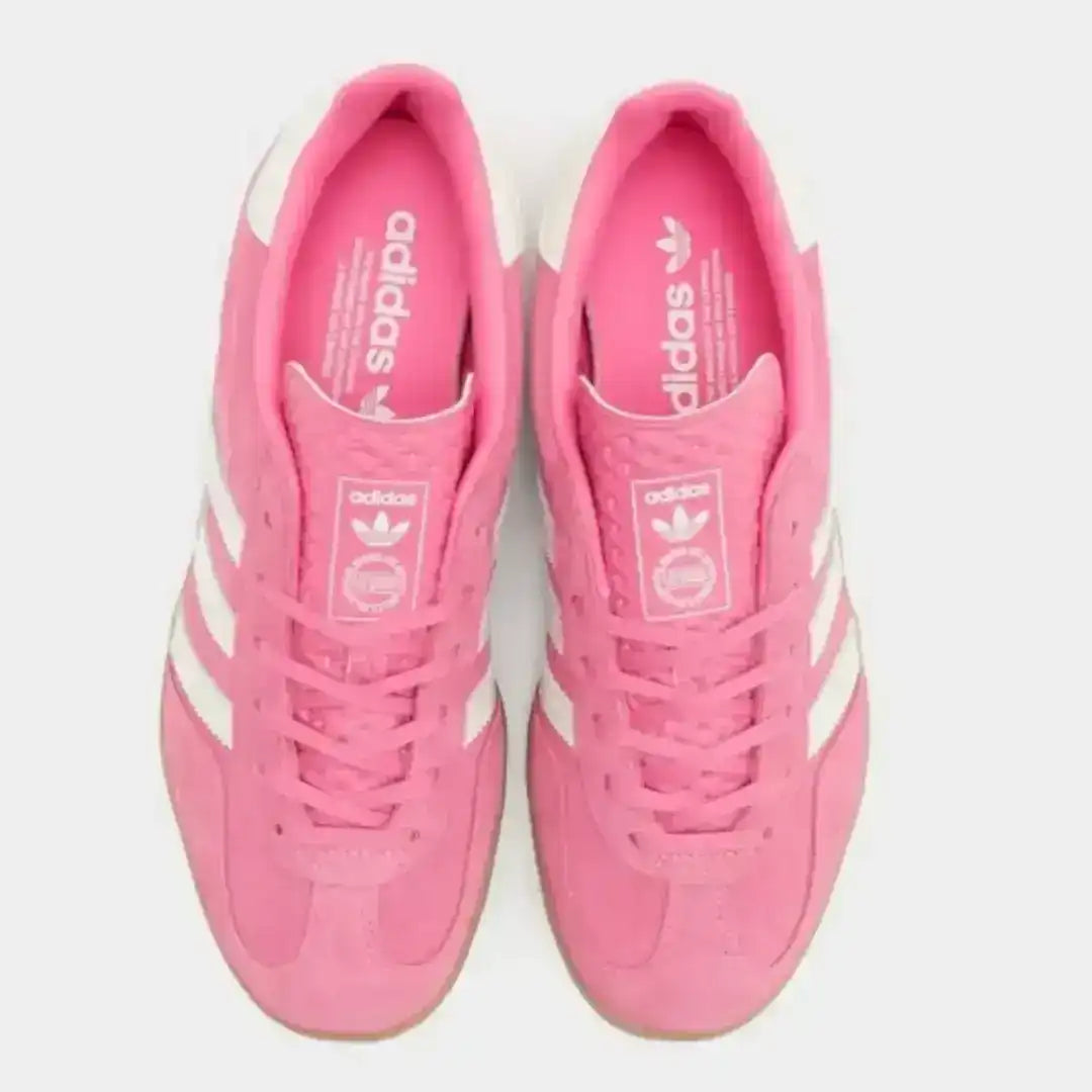 Side view of the Adidas Gazelle sneaker highlighting its timeless proportions, lace-up construction, and recognizable Adidas Originals branding.
