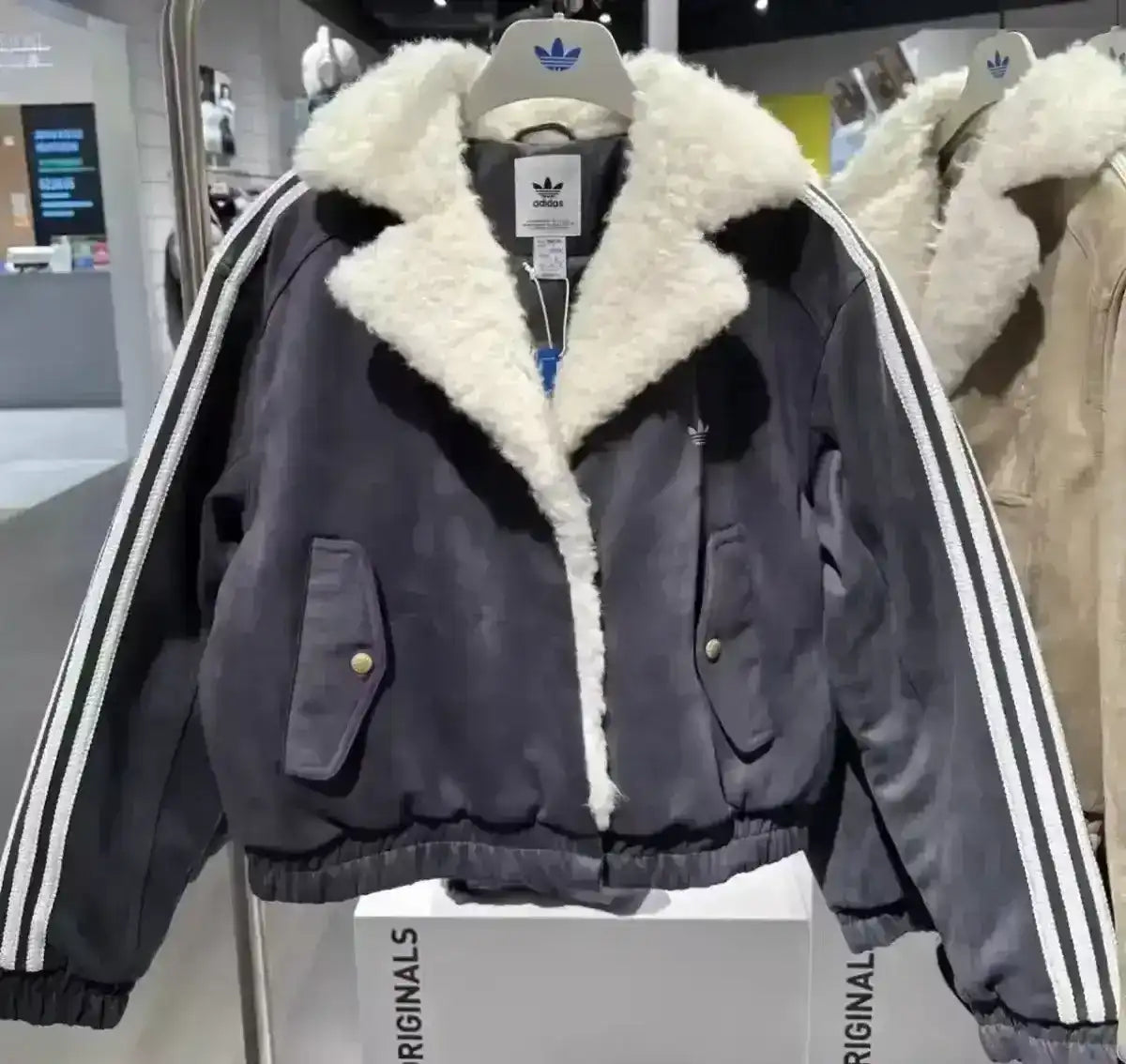 Adidas Originals jacket with faux suede texture and sherpa details
