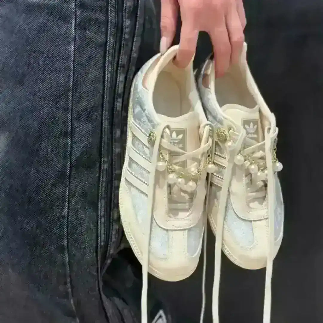 Cream Adidas Samba kicks customized with vintage floral print and luxury pearl straps, standing out in the popular Korean sneaker trend.