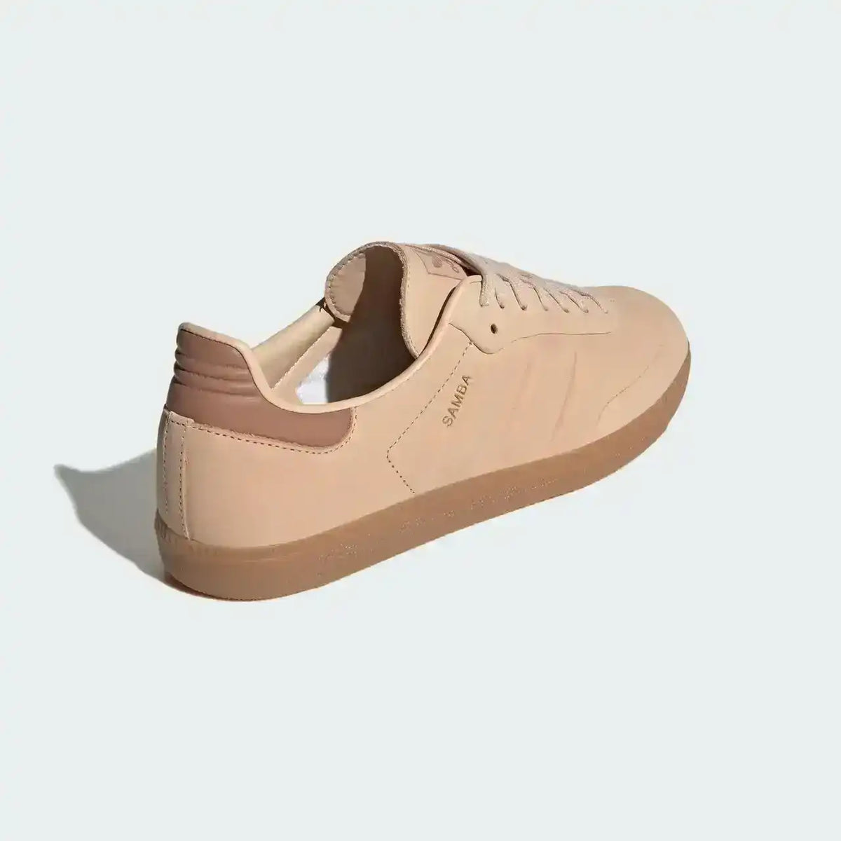 Adidas Samba Halo Blush Gum lifestyle sneaker in neutral blush palette with premium finish and classic gum outsole texture.