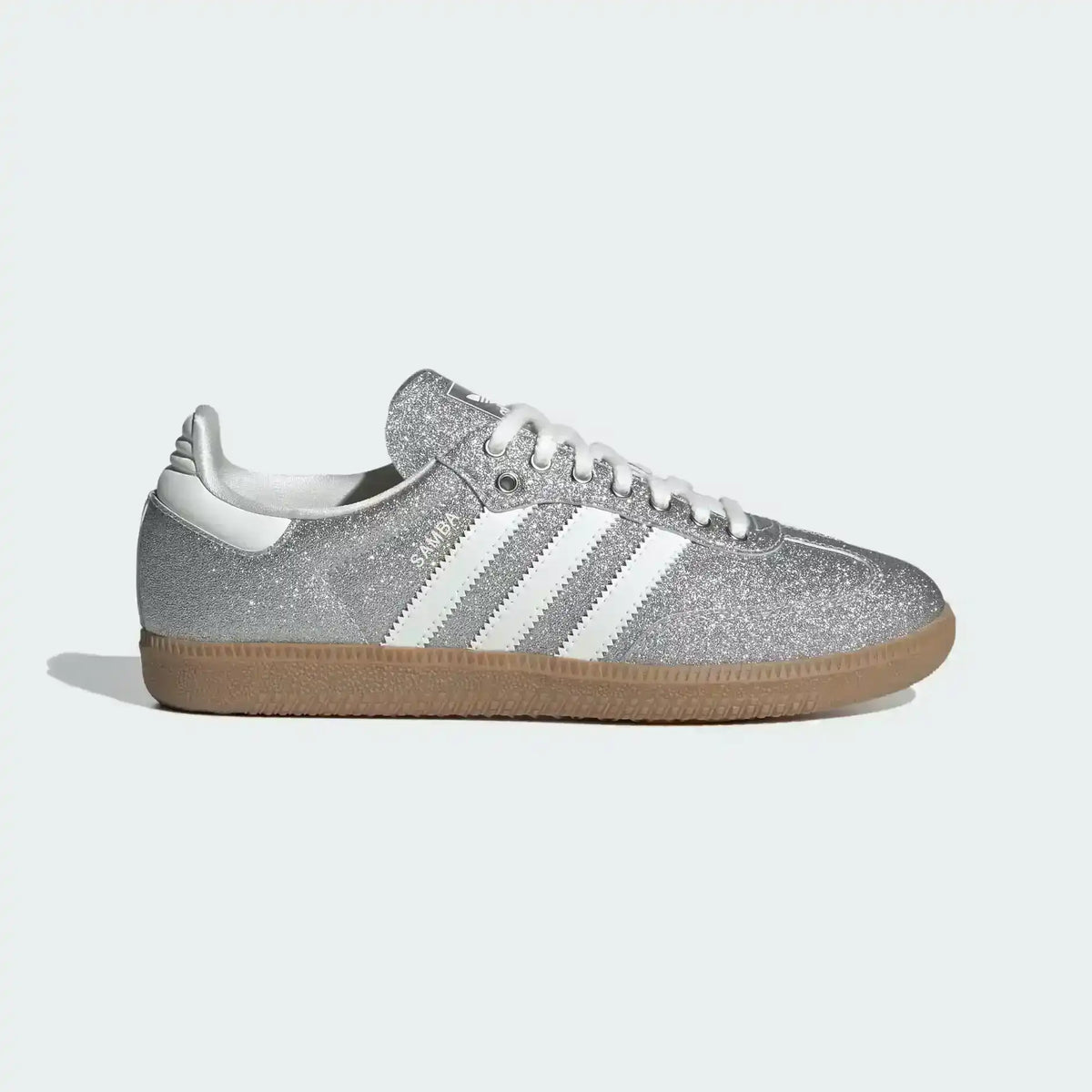 Low-top three-stripe sneakers with metallic-look panels, product views.