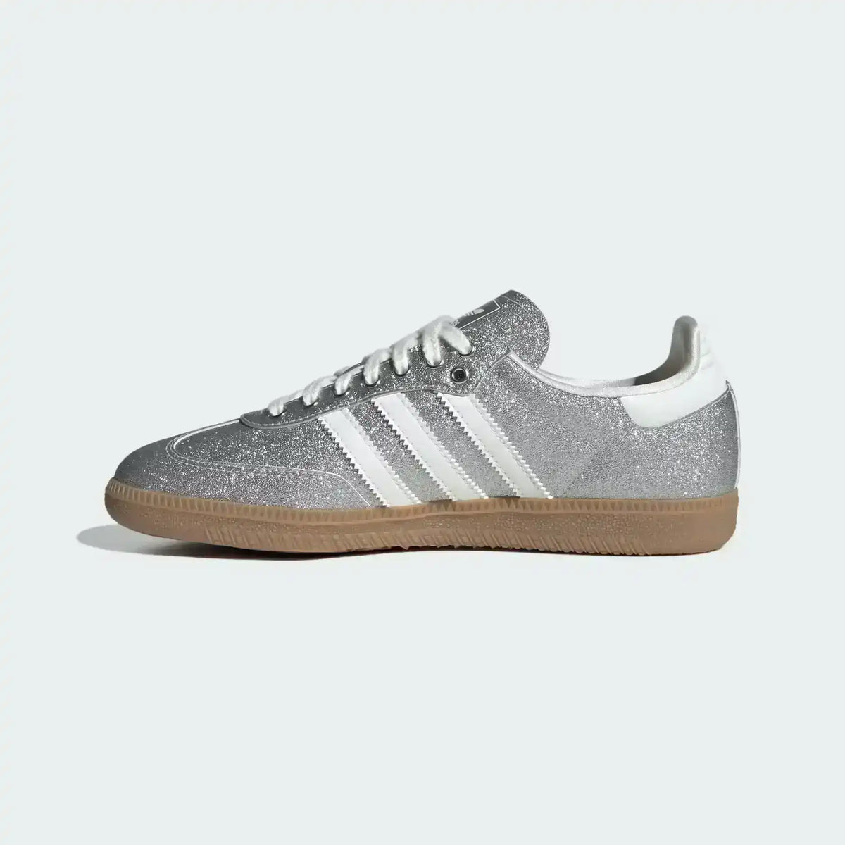 Low-top three-stripe sneakers with metallic-look panels, product views.