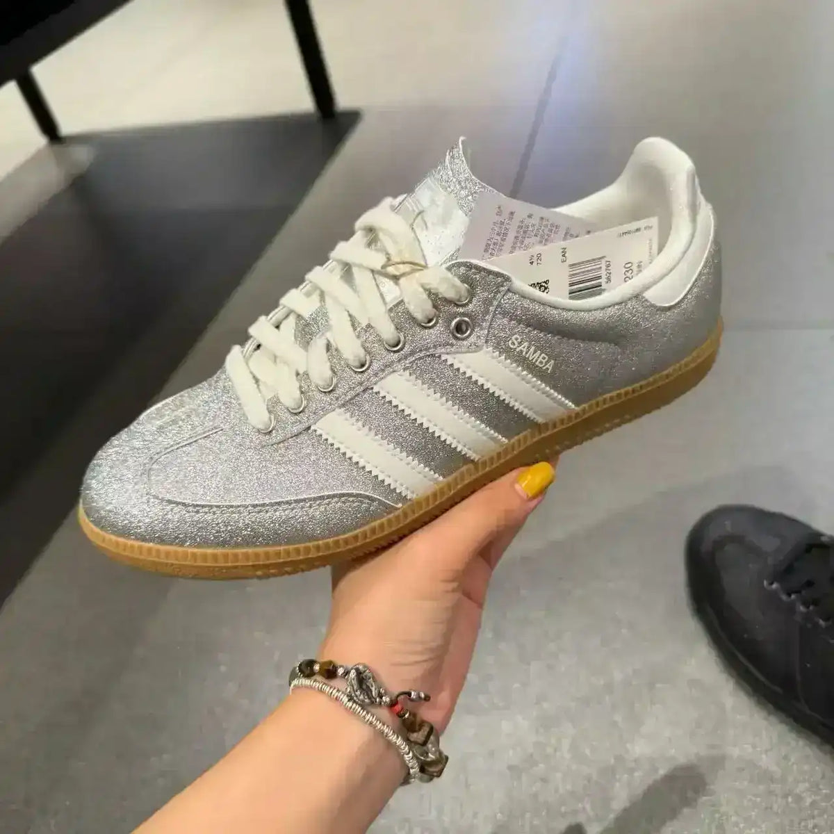 Low-top three-stripe sneakers with metallic-look panels, product views.