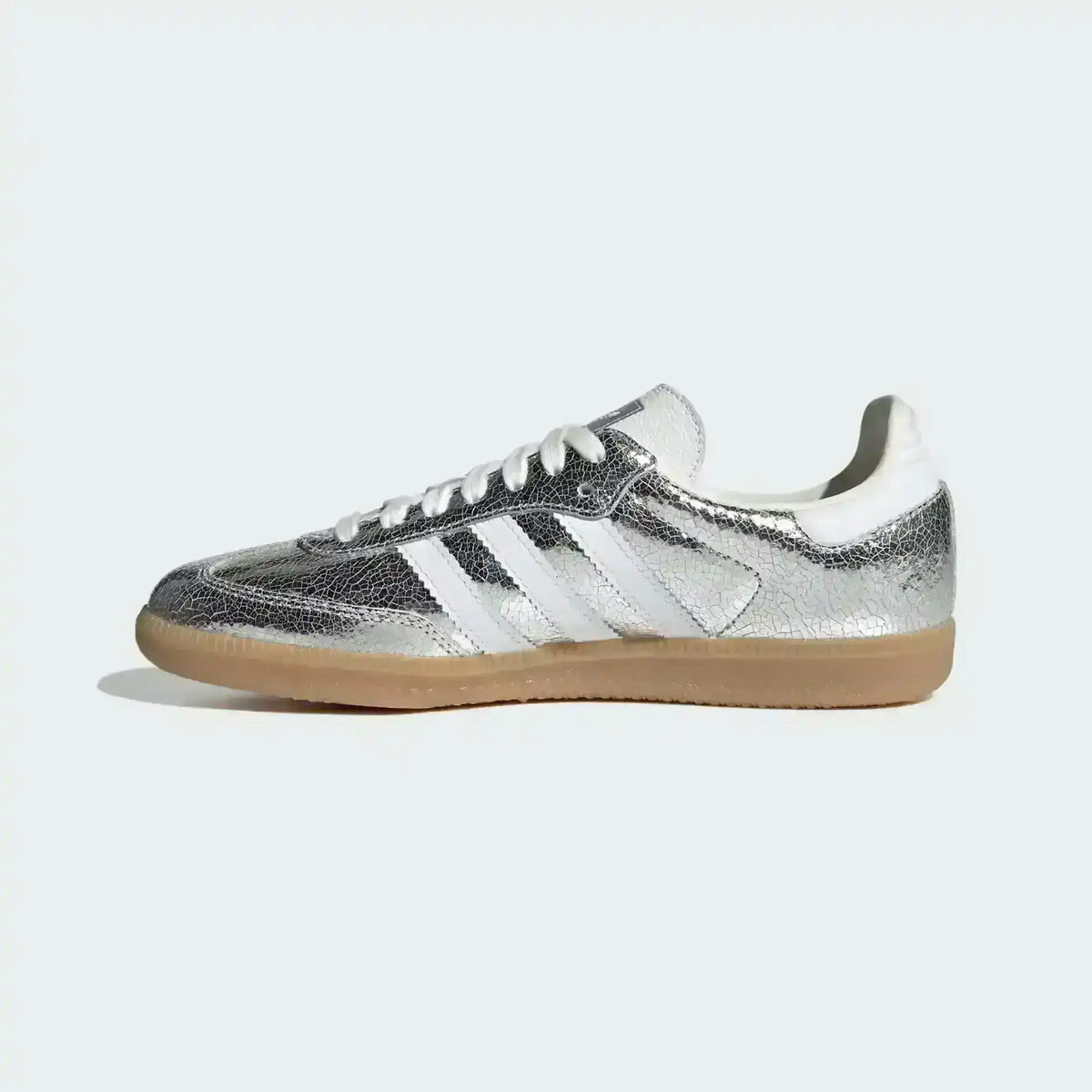 Low-top three-stripe sneakers with metallic-look panels, product views.