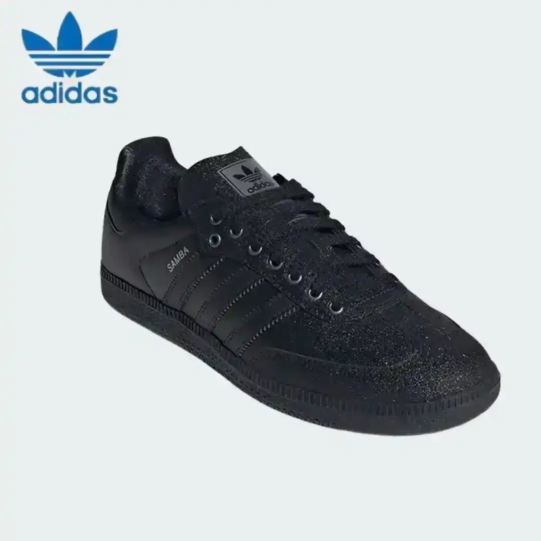 All-black Adidas Samba sneakers featuring a unique rough textured suede finish, perfect for adding depth to dark monochrome outfits.