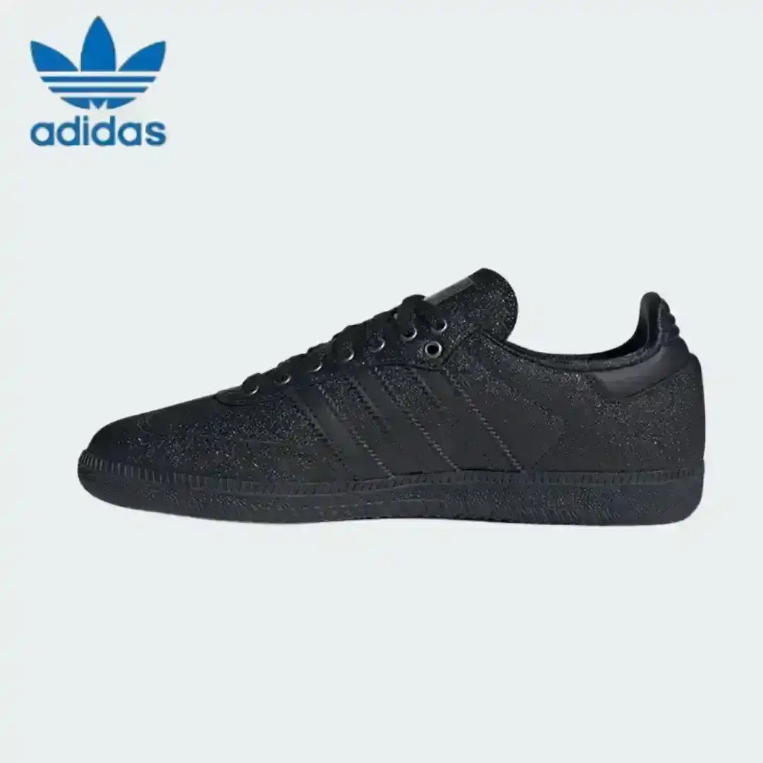 Women's Adidas Samba OG in triple black colorway with a custom coarse nubuck texture, ideal for trendy streetwear fashion looks today.