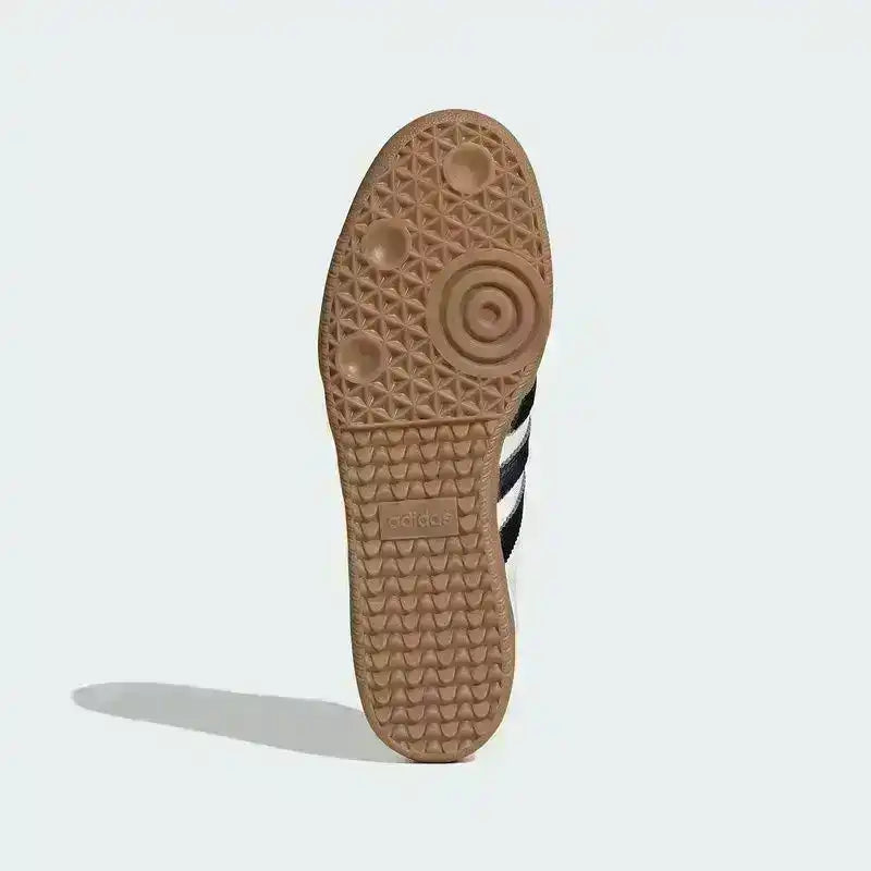 Gum-colored sneaker outsole with circular tread, bottom view.