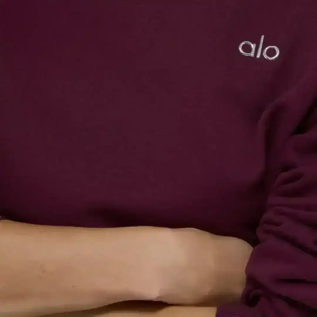 Crew-neck sweatshirt with small chest logo, product and model views.