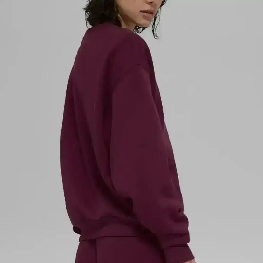 Crew-neck sweatshirt with small chest logo, product and model views.