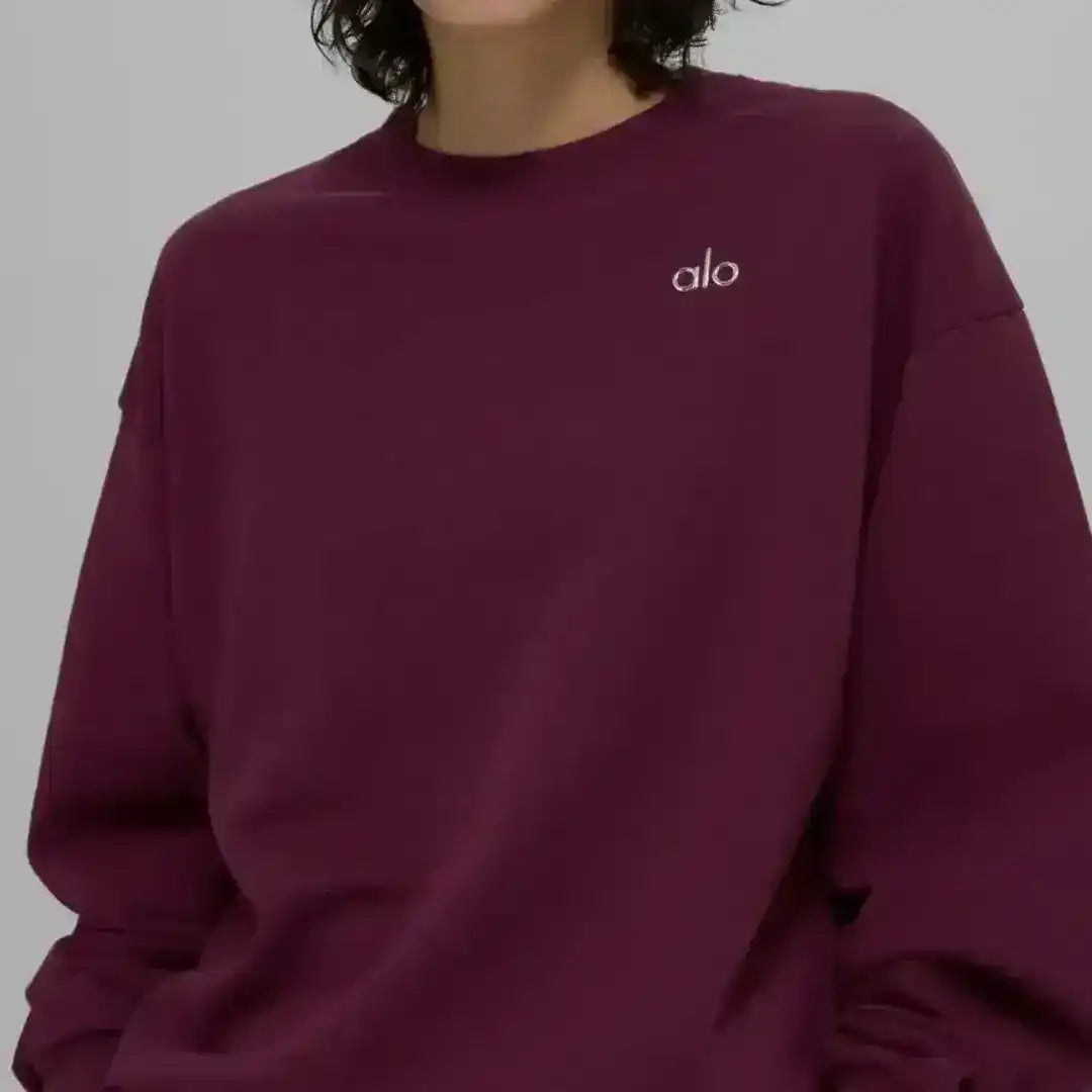 Crew-neck sweatshirt with small chest logo, product and model views.