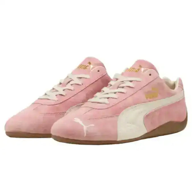 Pink sneakers with white accents on a white background