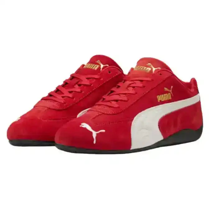 Red low-profile lace-up sneakers with cream curved side stripes.