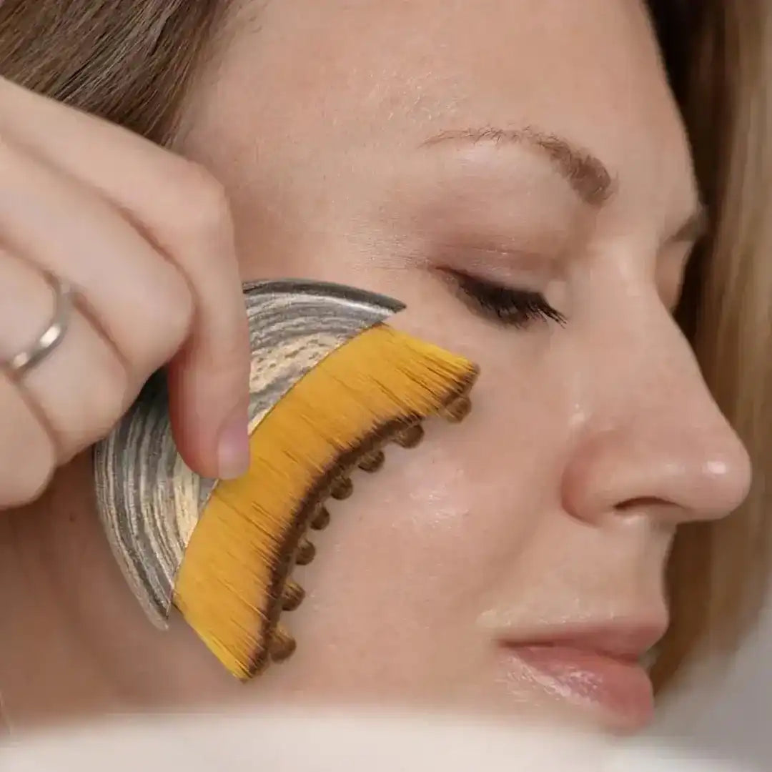 Curved textured facial massage tool, use and product illustrations.