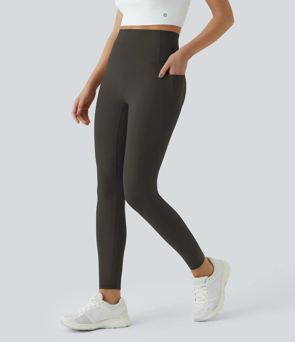 High-waisted leggings with curved seams, product and model views.