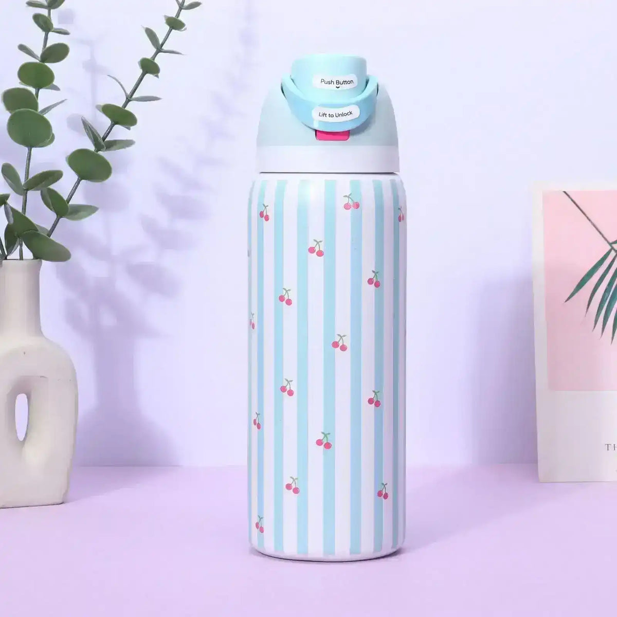 Reusable bottle with a hinged lid and carry loop, product views.