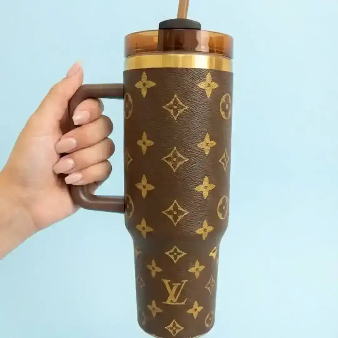 Insulated tumbler with repeating luxury-style pattern and handle
