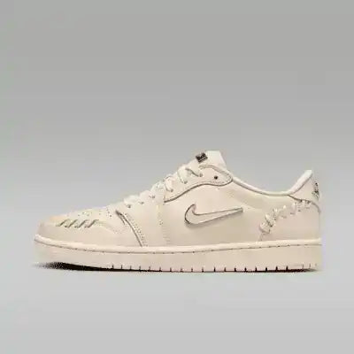 Cream low-top sneakers with swoosh details and tonal soles.