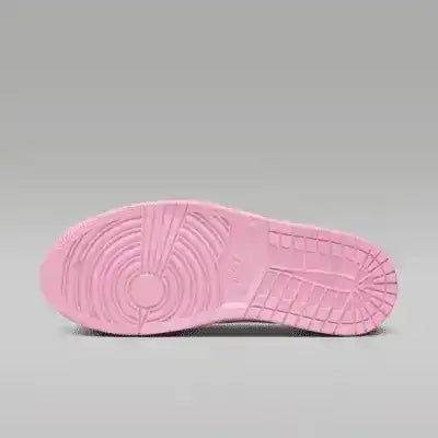 Pink sneaker outsole with circular tread, bottom view.
